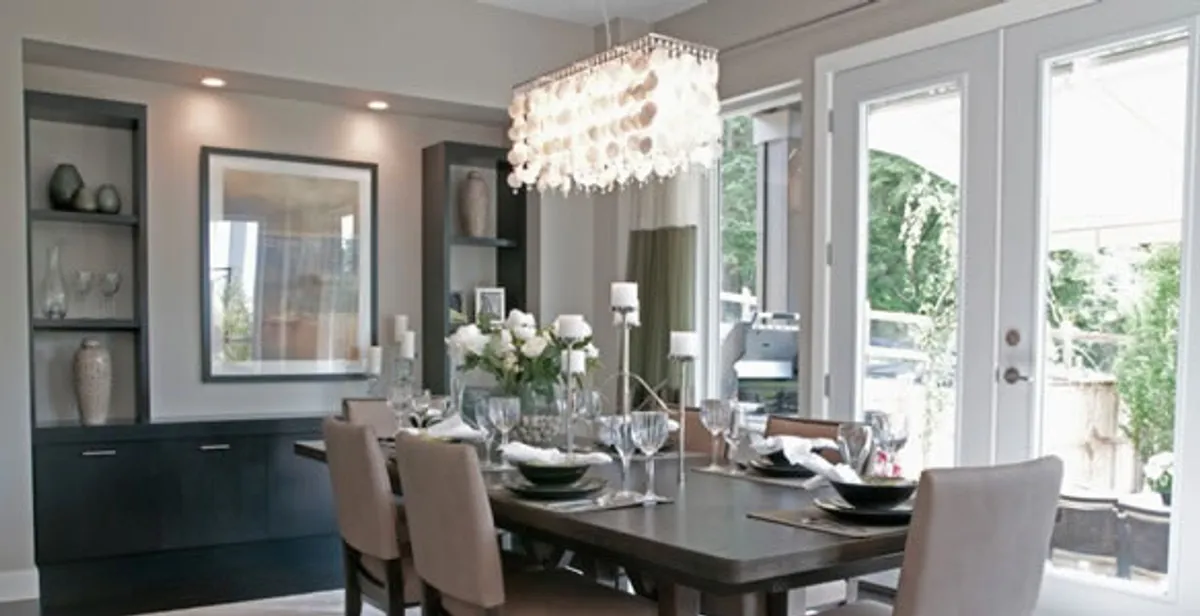 Elegant dining room chandelier installation above table in Sacramento, CA