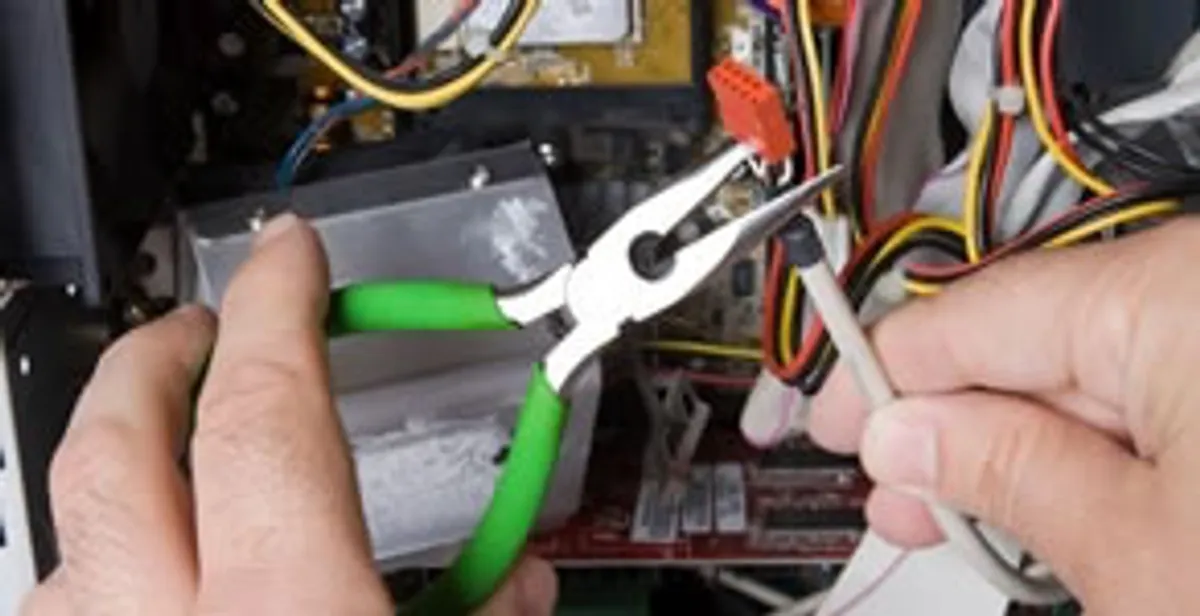 Licensed electrical contractor performing electrical repair with tools in Carmichael, CA